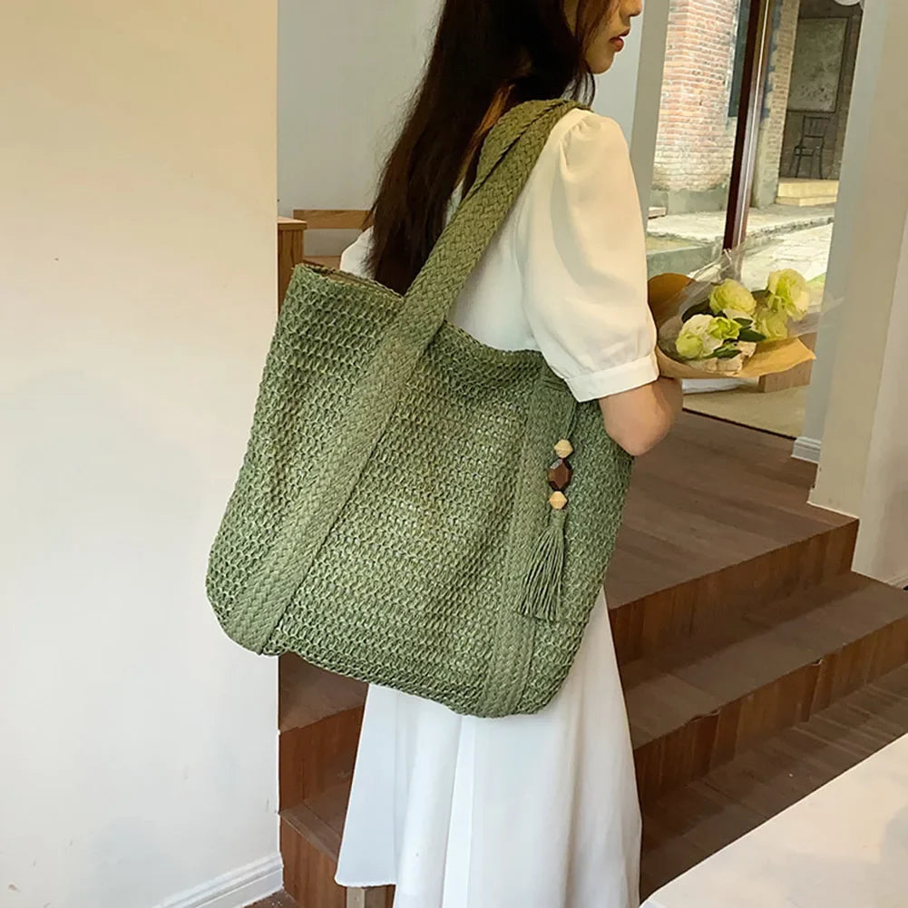 Beige boho straw beach tote bag with woven handles