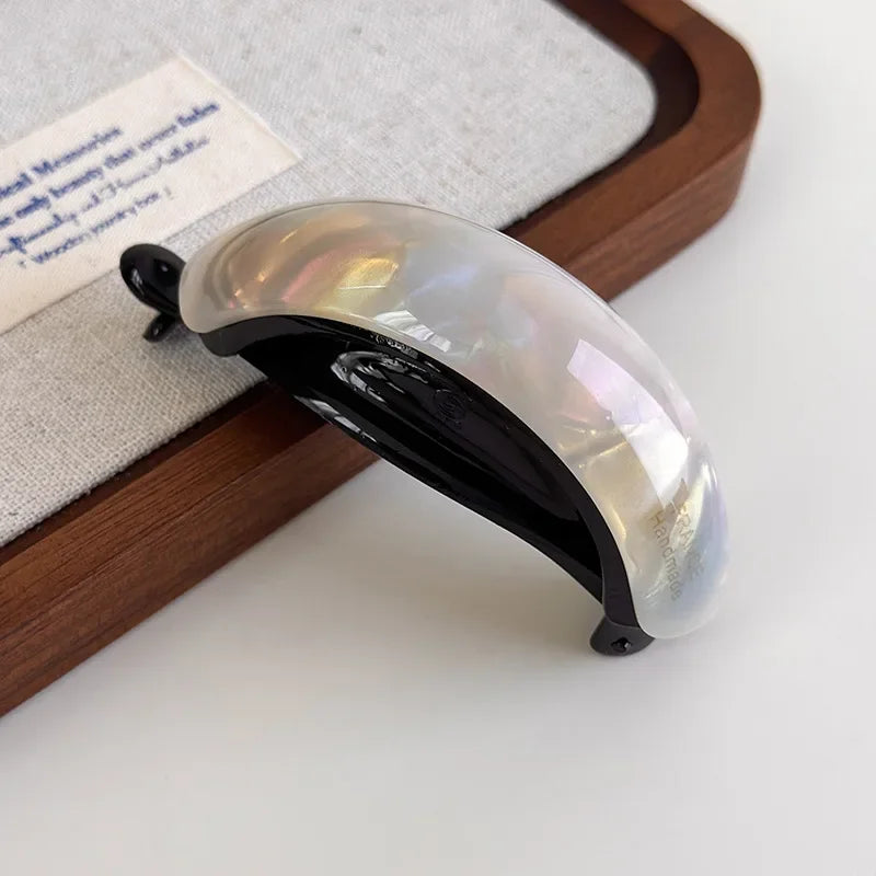 Claw clip holding a half-up hairstyle