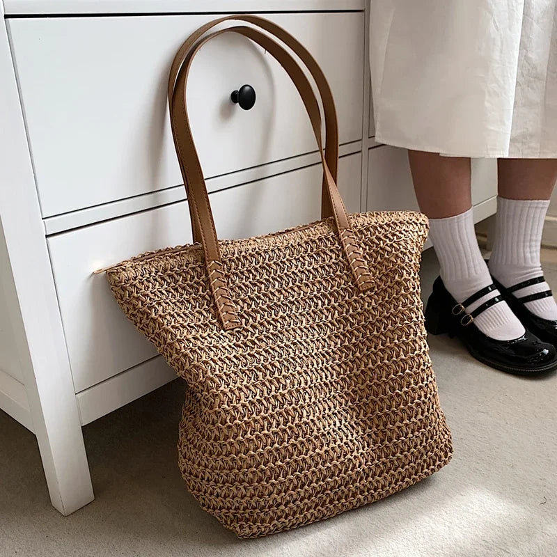 Woven straw summer handbag with a relaxed slouchy shape