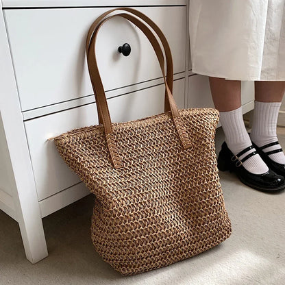 Woven straw summer handbag with a relaxed slouchy shape